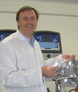 Plant Manager Franz Zerobin next to the new LED assembly line